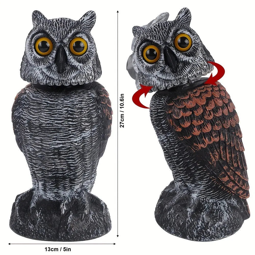 Artificial owl bird deterrent ornament with shaking head design in outdoor garden setting
