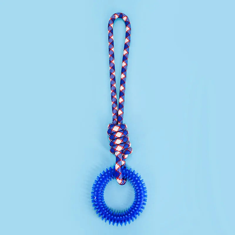 Blue braided rope dog toy with a knot, shown on a wooden floor.