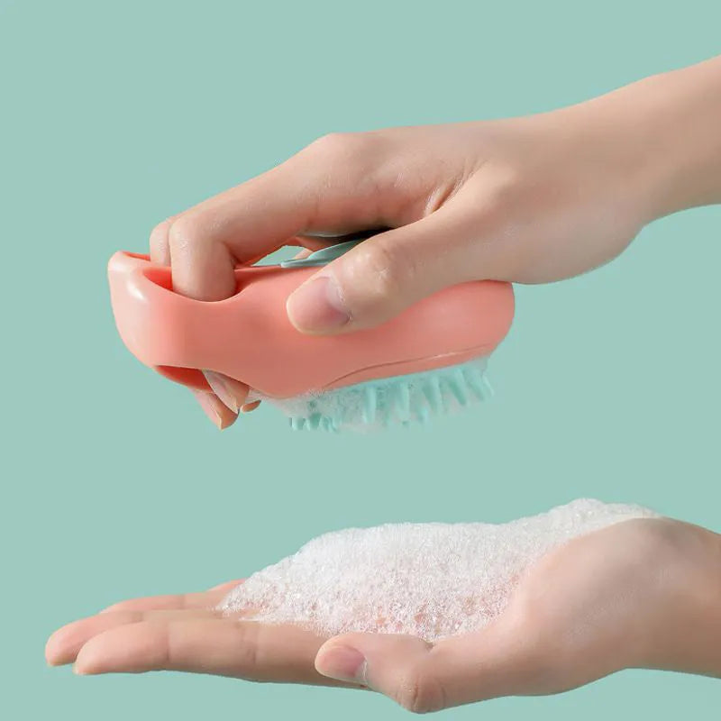 Blue pet bath and massage brush with silicone bristles and an ergonomic non-slip handle.