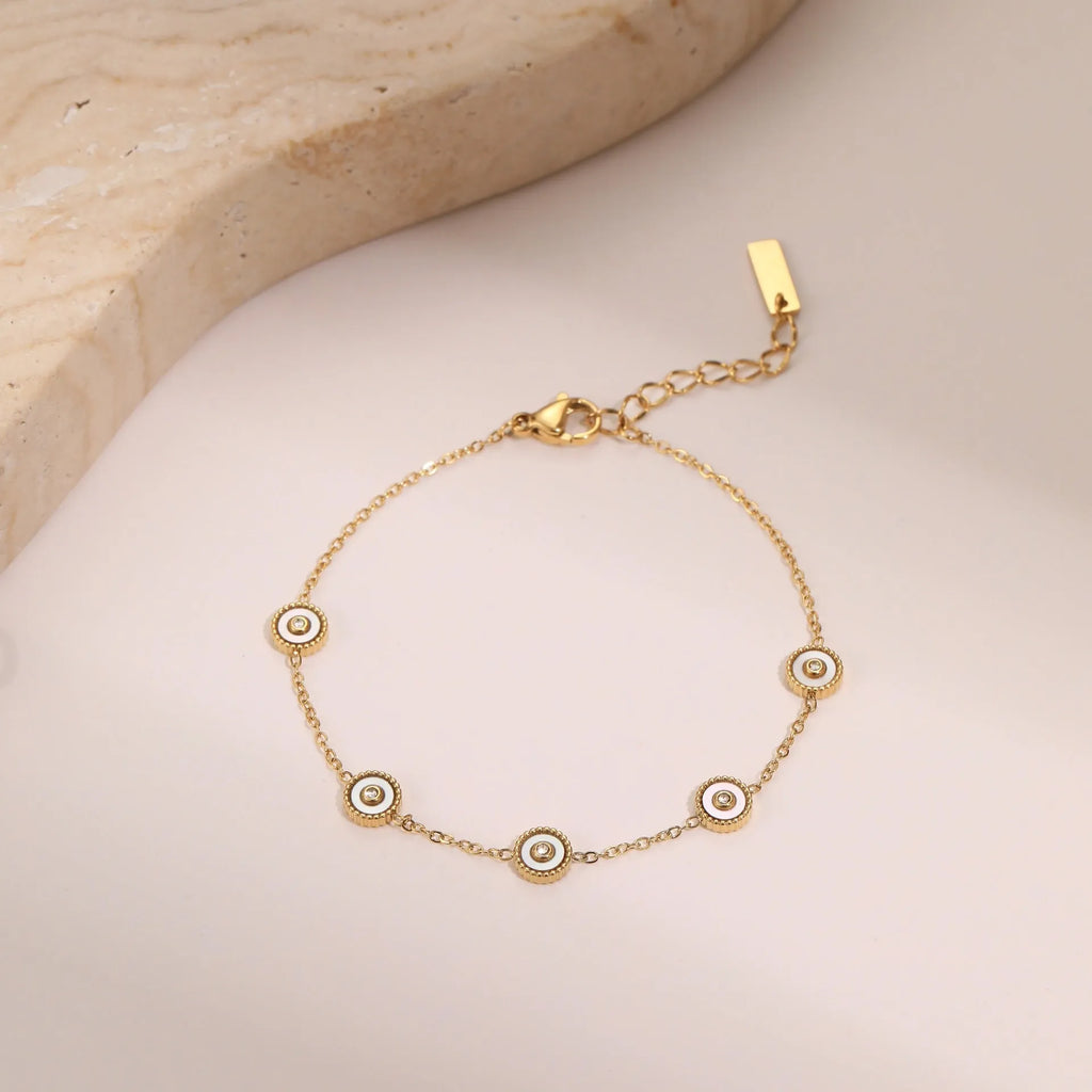 Women's stainless steel bracelet with 18K gold plating and geometric fritillary charm, includes matching necklace