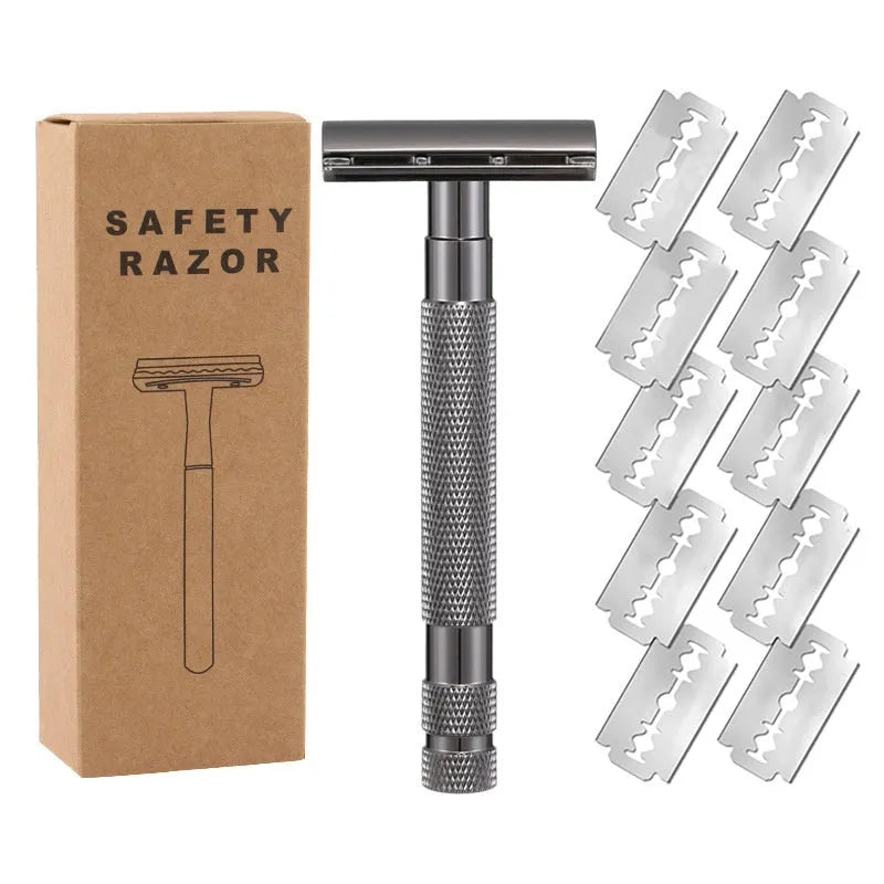 Manual double-sided safety razor with alloy handle, shown with replacement blades on a towel.