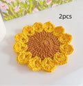 Hand-woven wool flower coasters showing floral pattern texture and natural wool material