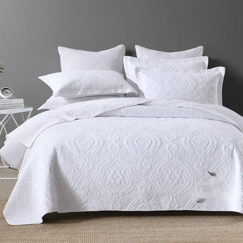Pure cotton bed cover three-piece set shown in a light colour on a bed, featuring a quilt cover and sheet.