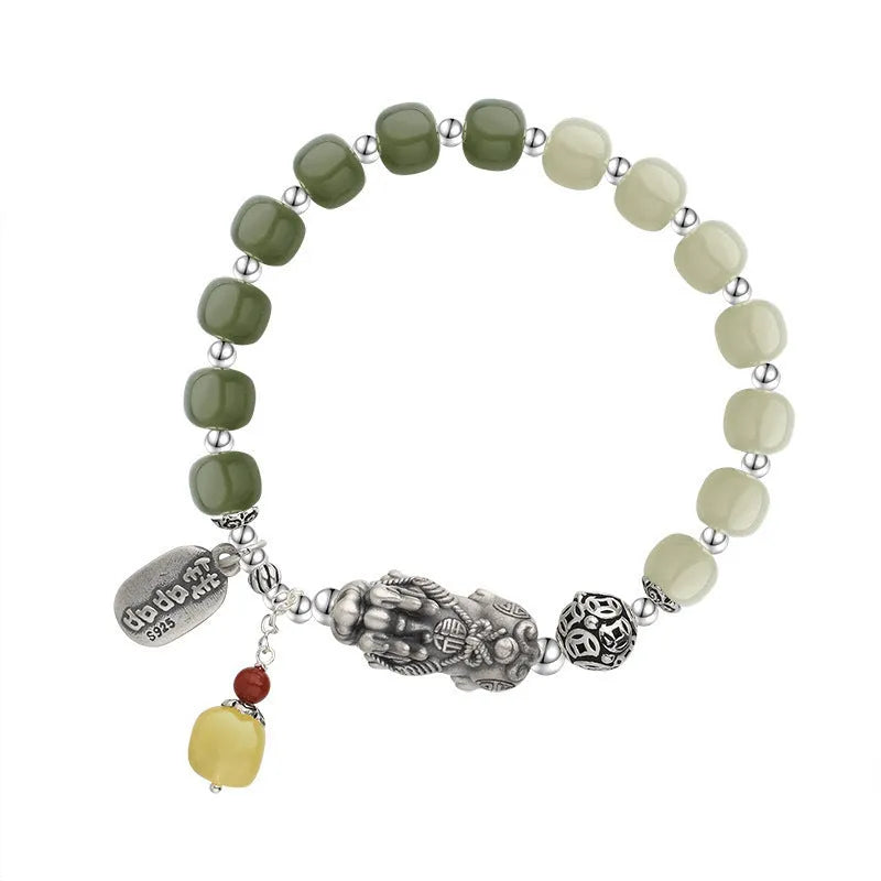 Retro women's pure silver bracelet with a Natural Hetian Jade stone and an 8mm coin charm.