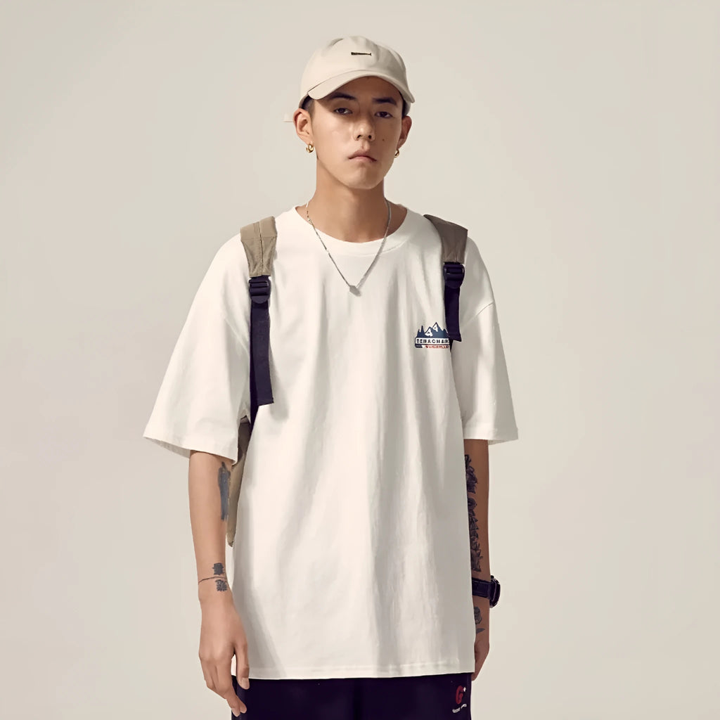 Men's black loose fit short-sleeved t-shirt on a hanger