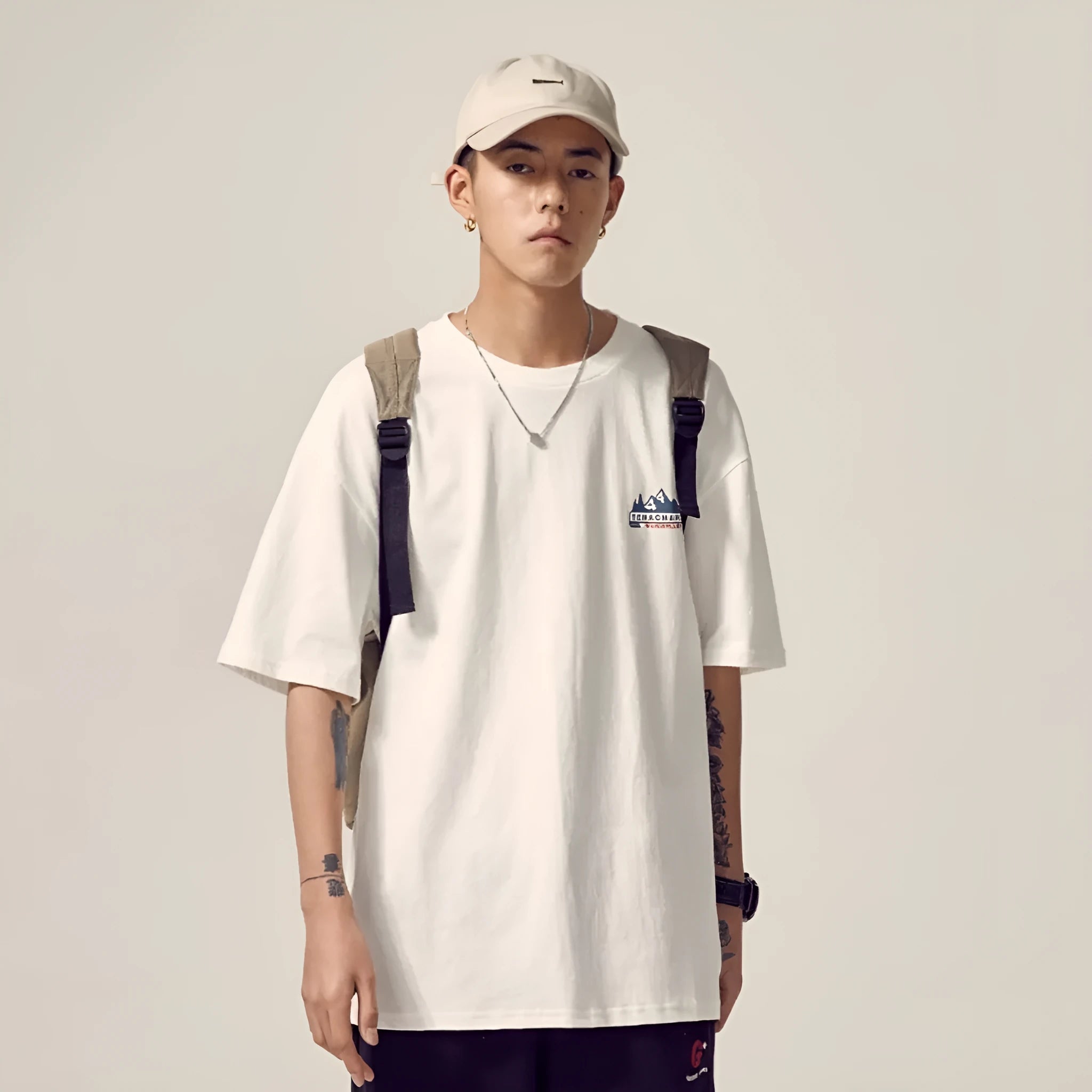 Men's black loose fit short-sleeved t-shirt on a hanger