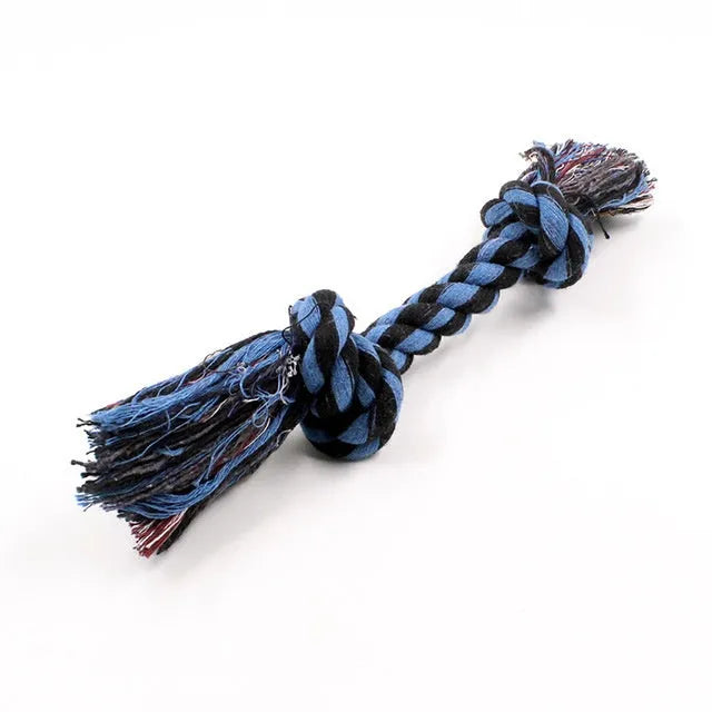 Double knot cotton rope dog toy on neutral background showing two rope knots and loose ends