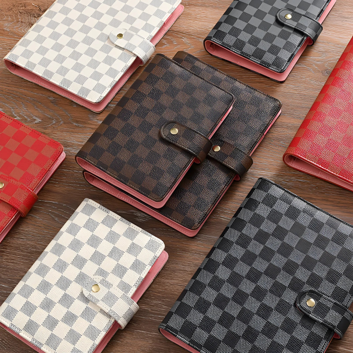 Loose-leaf notebook with imitation leather cover in A5 size, red colour, open showing ring binding and blank pages