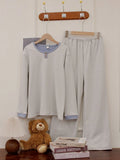 Women's velvet round neck pullover pyjama set with long sleeves and striped trousers in light blue