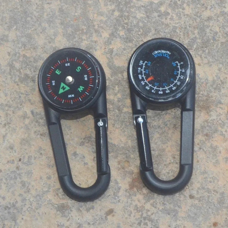 Army green zinc alloy outdoor carabiner with built-in fluid compass and liquid thermometer showing temperature scale