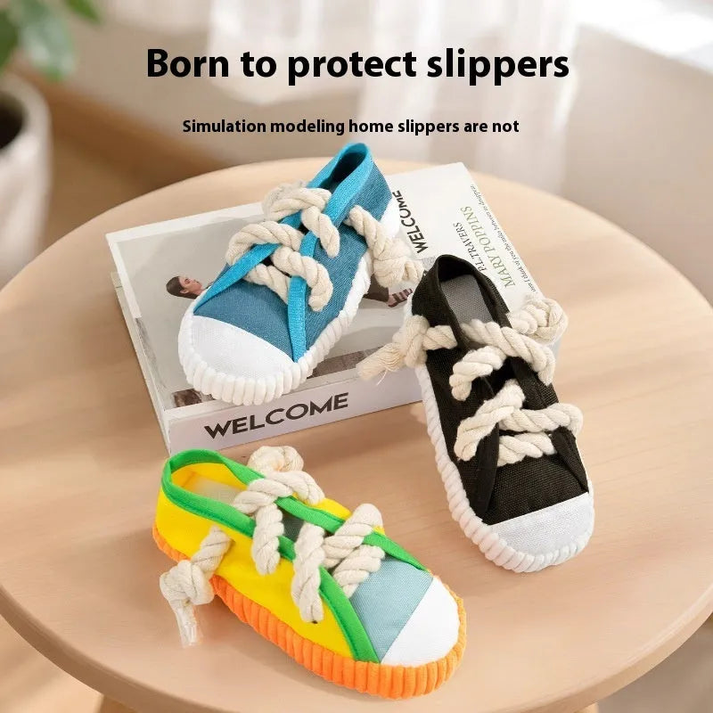 Plastic dog toy shaped like slippers in yellow, black, or blue, designed for chewing and making sound.
