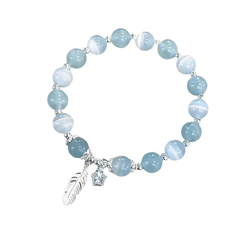 Small white crystal bracelet with eight star design in blue moonlight colour