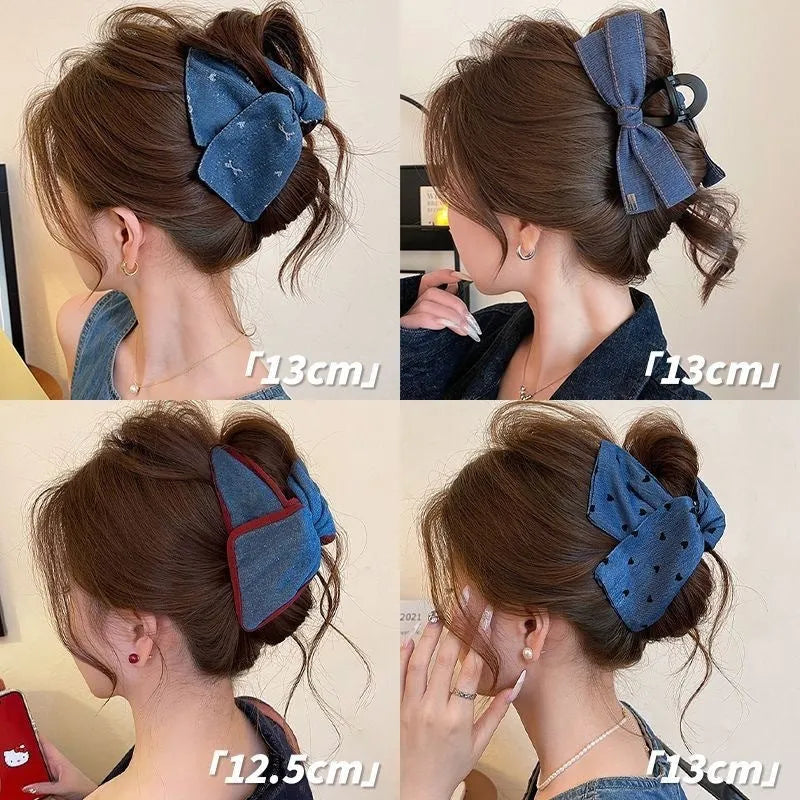 Handmade denim fabric and acrylic hair bow with triangle grip detail on plastic hairpin.