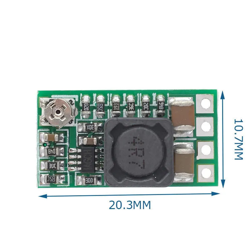 Green mini DC-DC step down power module converting 12-24V to 5V 3A output.