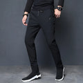 Men's plain polyester sports trousers with velvet lining, black, loose fit, small trouser mouth, non-iron