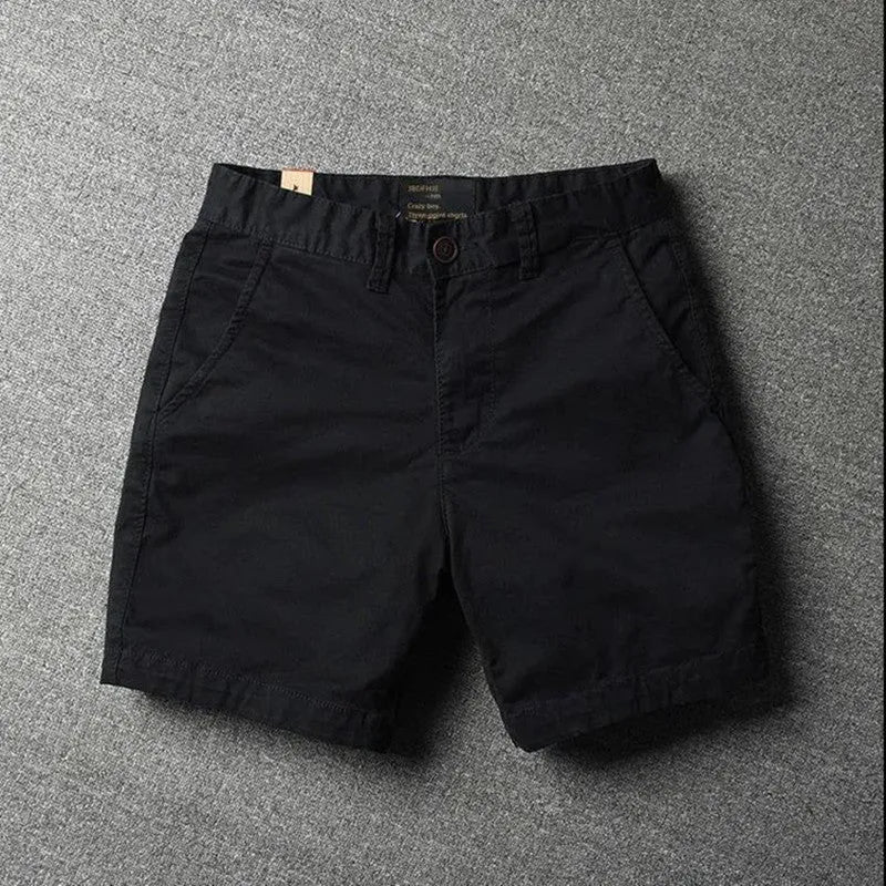 Men's cotton loose shorts in straight-leg cut with zipper fly, shown in multiple colour options including camouflage patterns
