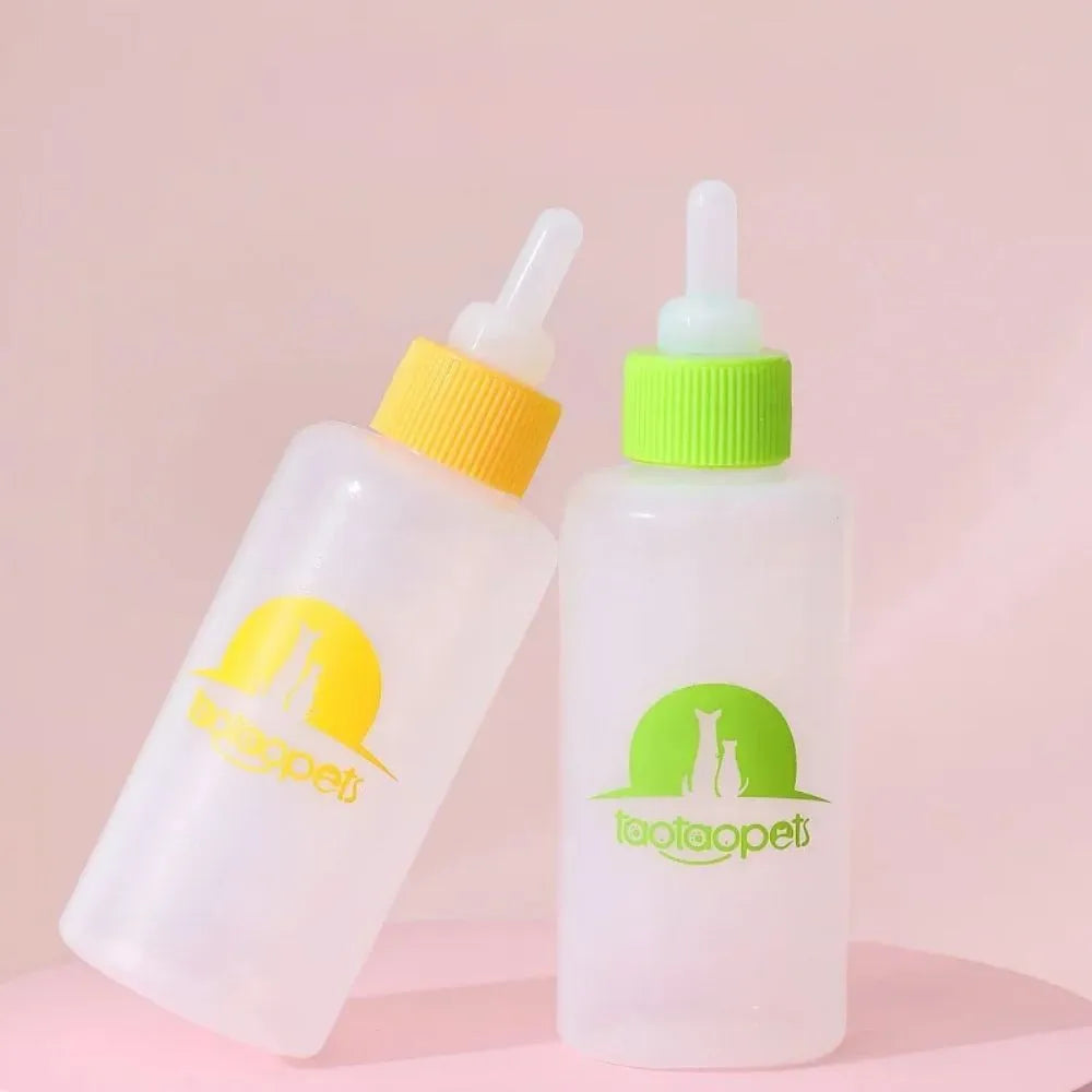 Set of four coloured pet milk bottles and a cleaning brush for feeding small animals