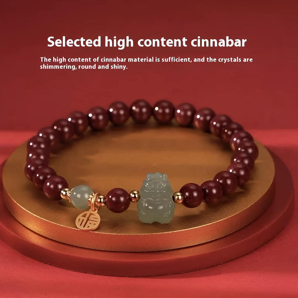 Handmade Hetian jade bracelet with cinnabar inlay showing 8mm beads and animal zodiac modelling
