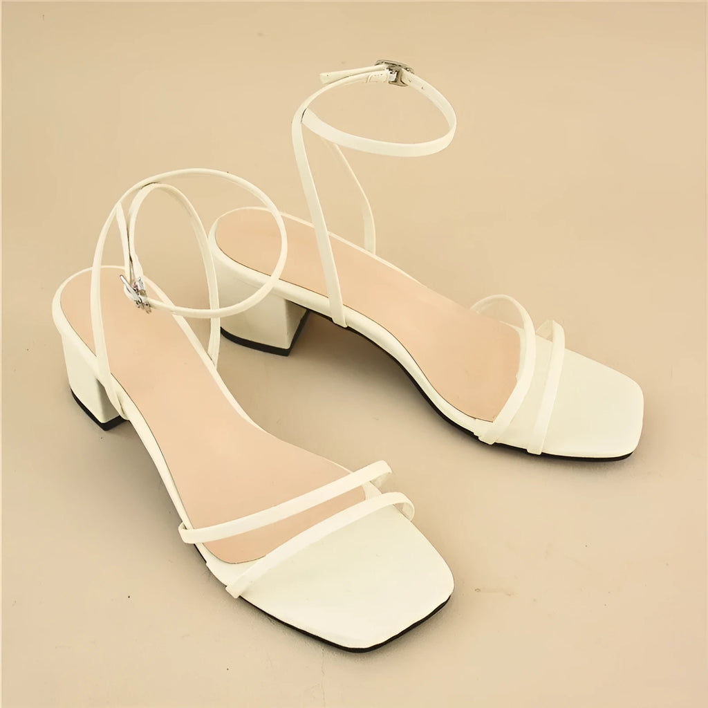 Beige women's chunky heel sandals with a square toe and ankle strap on a rubber sole.