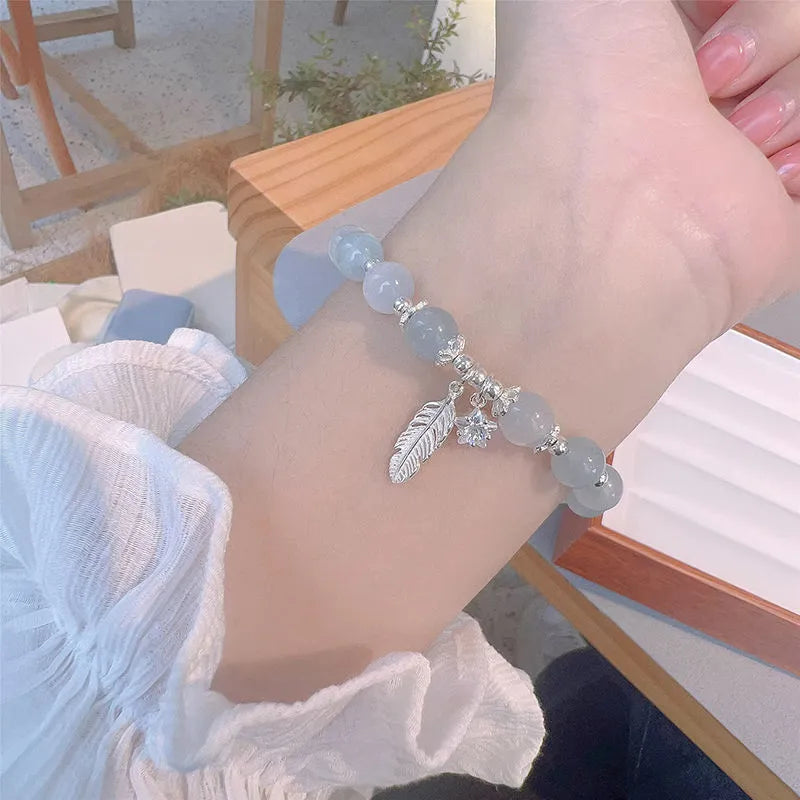 Small white crystal bracelet with eight star design in blue moonlight colour