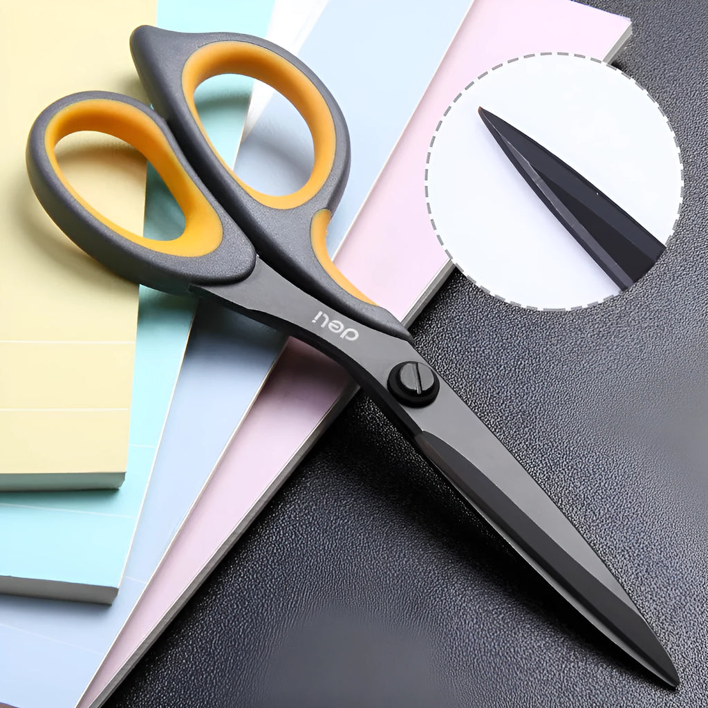 Black plastic handle alloy stainless steel scissors 175mm 6 inch blade on white background