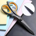 Black plastic handle alloy stainless steel scissors 175mm 6 inch blade on white background