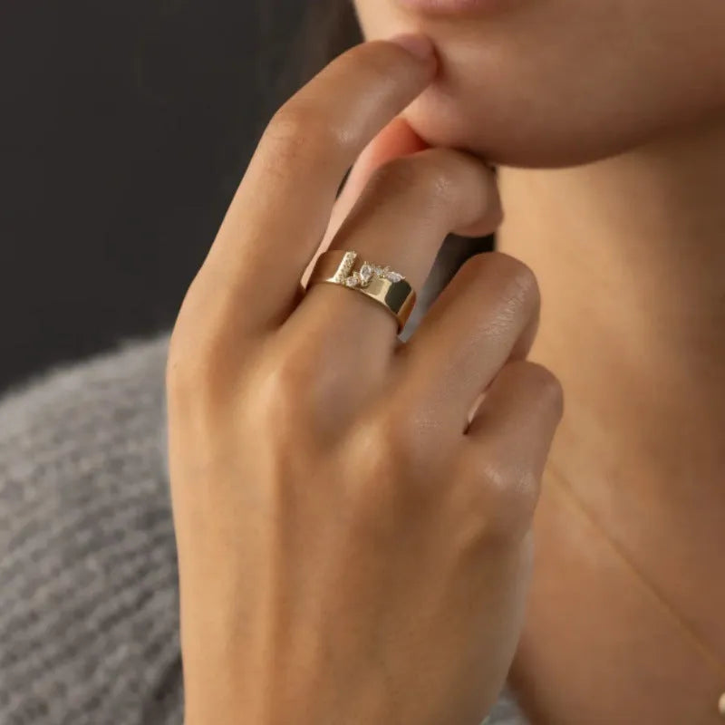Gold electroplated women's copper ring with shining zircon details showing personality style