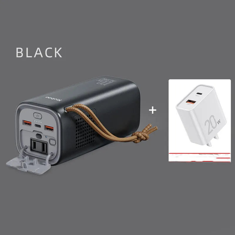 Black portable power bank with solar panel, showing USB ports and car charging socket
