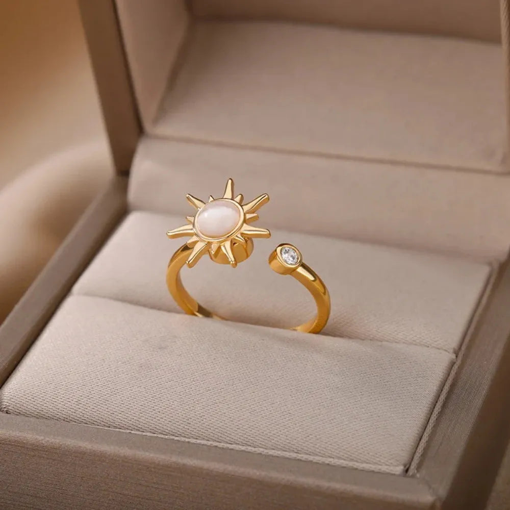 Adjustable copper decompression ring with rotatable element in gold or platinum finish