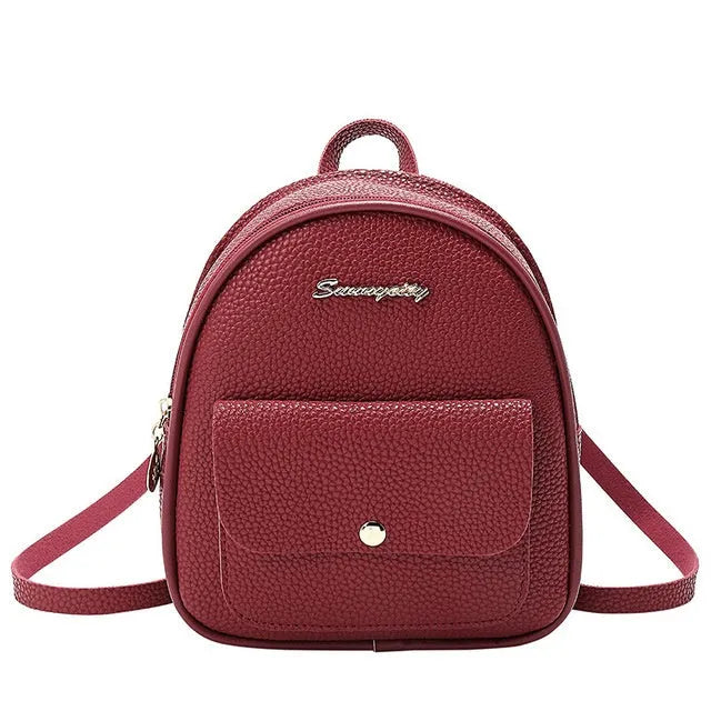 Women's small black PU shoulder backpack with a letter purse and zipper closure.