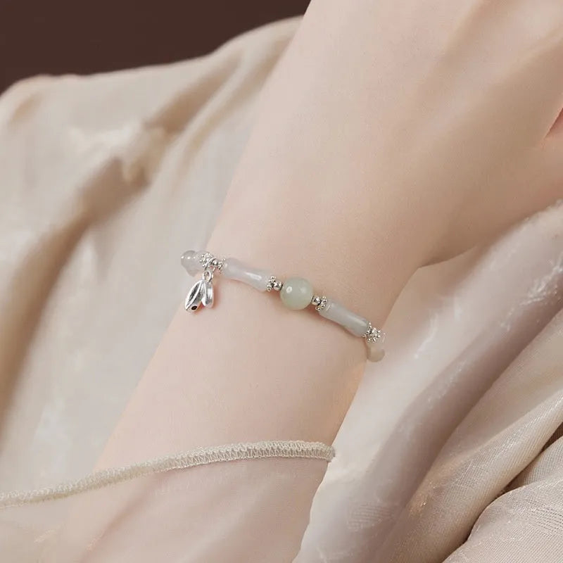 Natural Tianshan green bamboo and sterling silver antique-style bracelet for women with a bamboo joint motif.