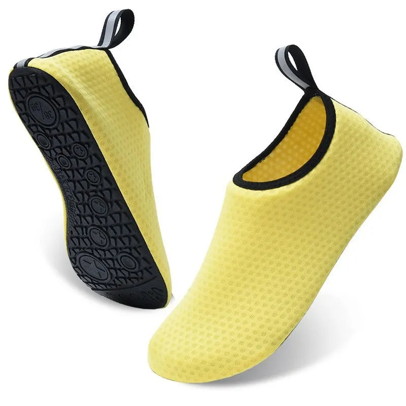 Non-slip soft bottom beach shoes with mesh uppers and TPR soles in various colour designs