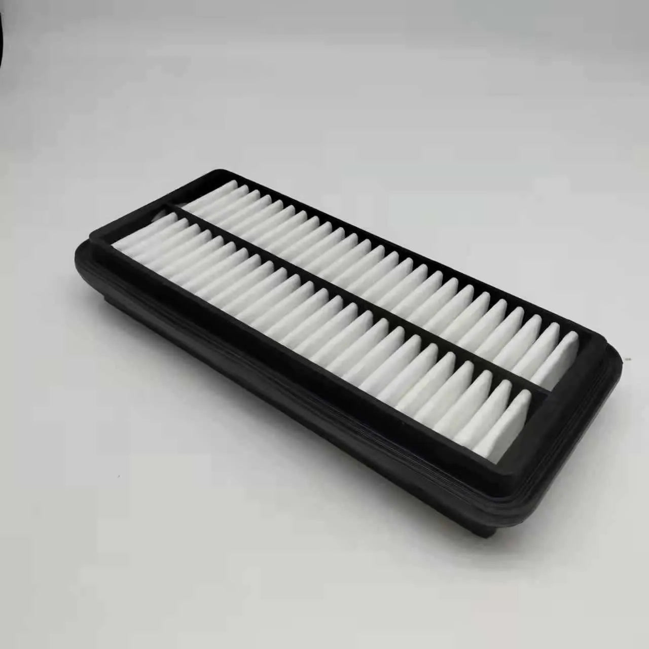 Black rectangular car air filter measuring 256mm by 113mm by 40mm dimensions