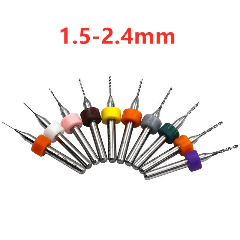 Ten tungsten carbide PCB drill bits with straight shanks on a white background