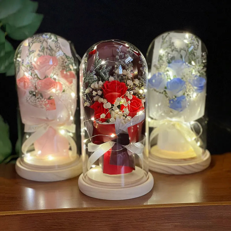 Dried flower and soap flower bouquet under glass dome on wooden LED base, available in multiple colours including Aisha Pink and Light Purple