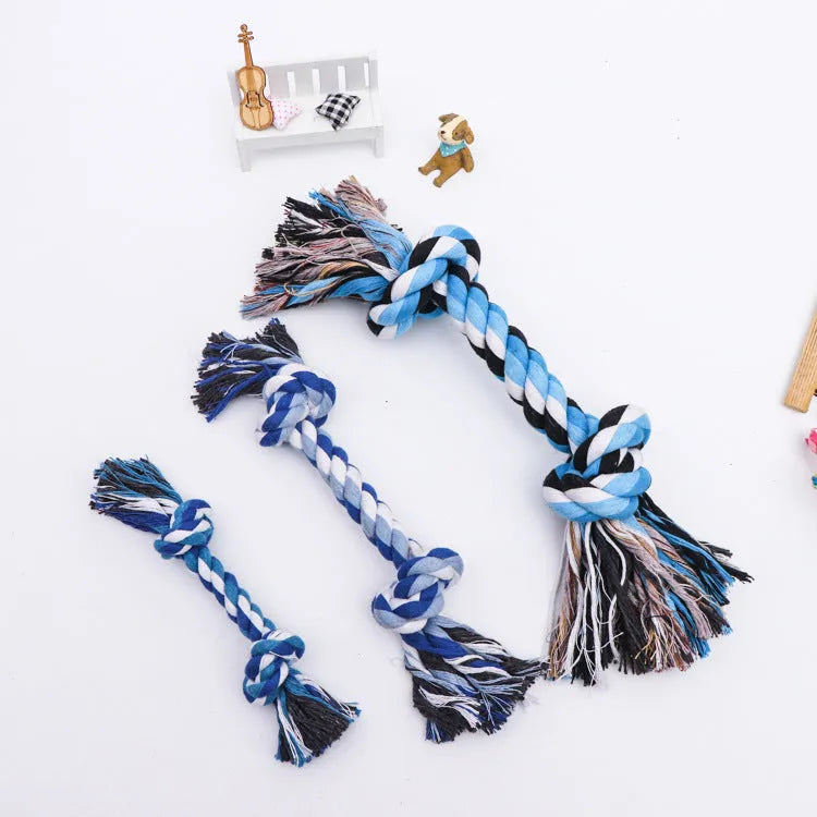 Double knot cotton rope dog toy on neutral background showing two rope knots and loose ends