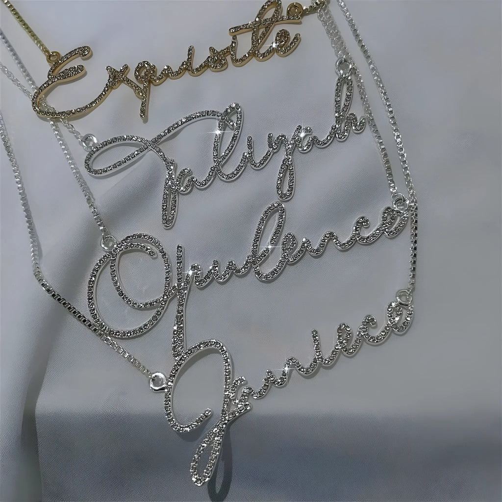 Stainless steel personalised name necklace with diamond studs on a silver chain, showing the letter 'A'.