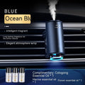 Obsidian black car vent clip aroma diffuser with essential oil bottle on a car air vent