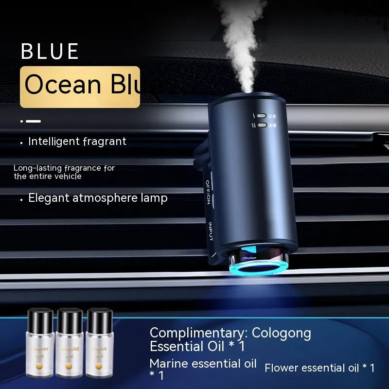 Obsidian black car vent clip aroma diffuser with essential oil bottle on a car air vent