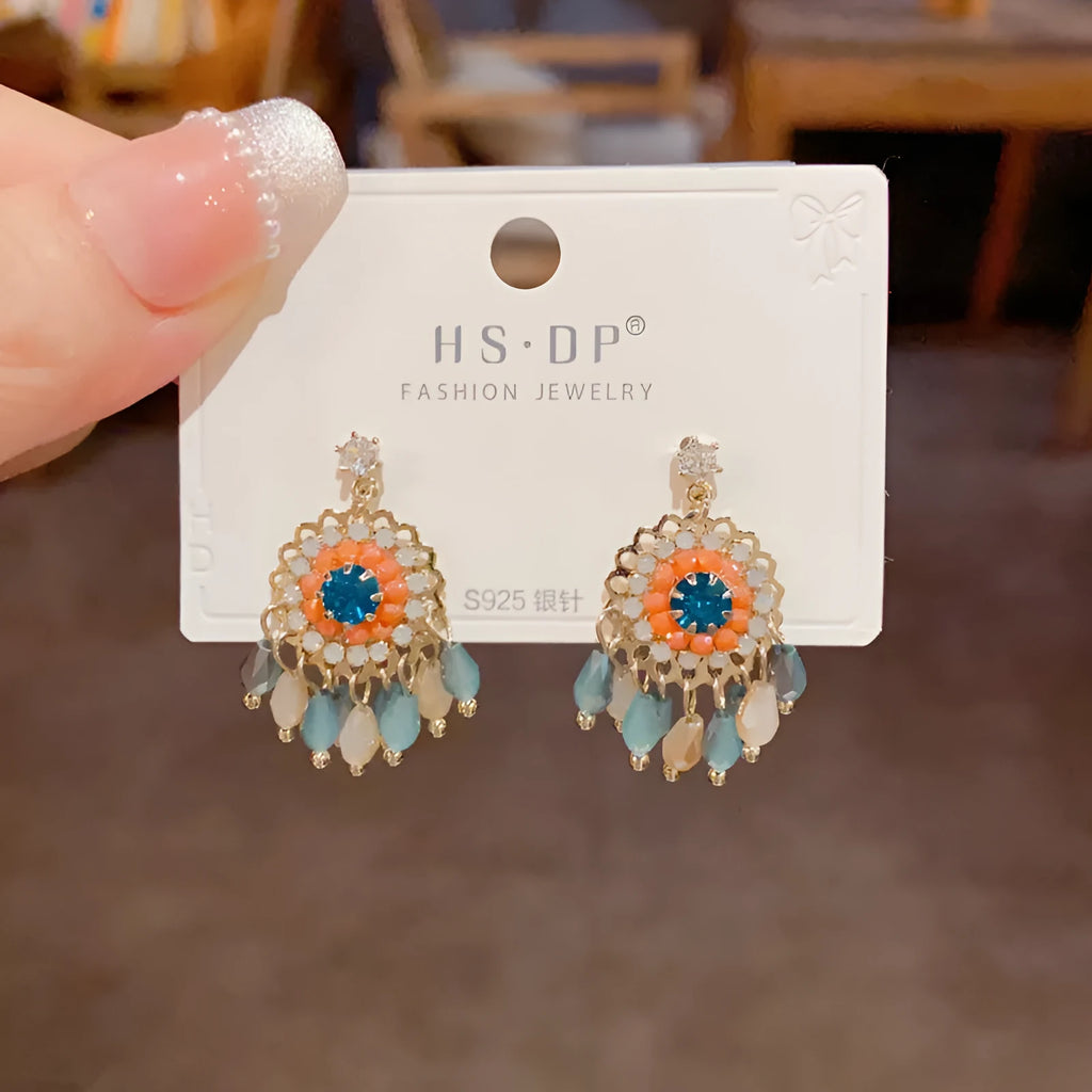 Geometric crystal tassel earrings with thick gold plating and embedded diamond crystals