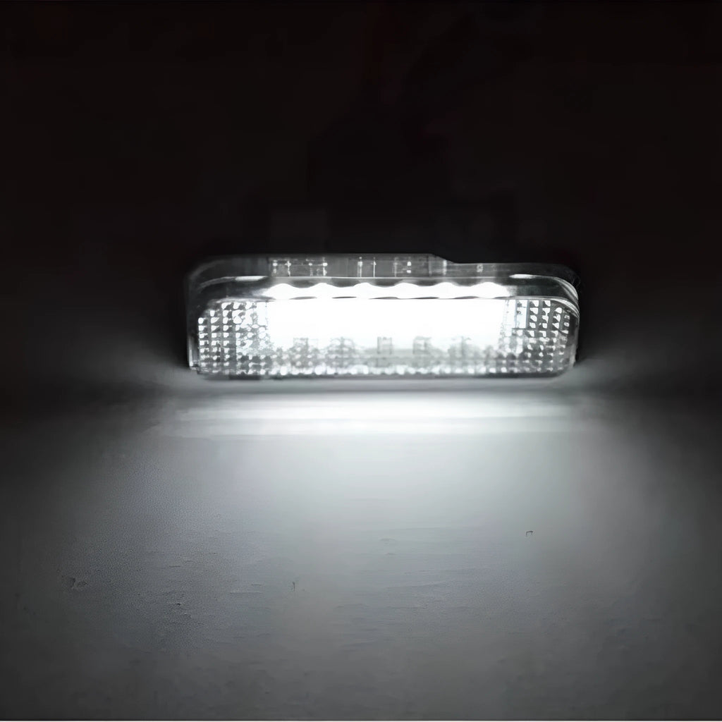 Mercedes Benz LED licence plate light unit showing white PC housing and 18 LED beads.