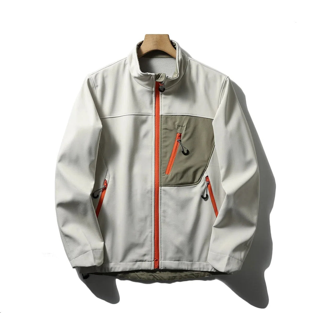 Men's retro patchwork contrast colour stand-up collar coat in Misty White, side view showing zipped pockets