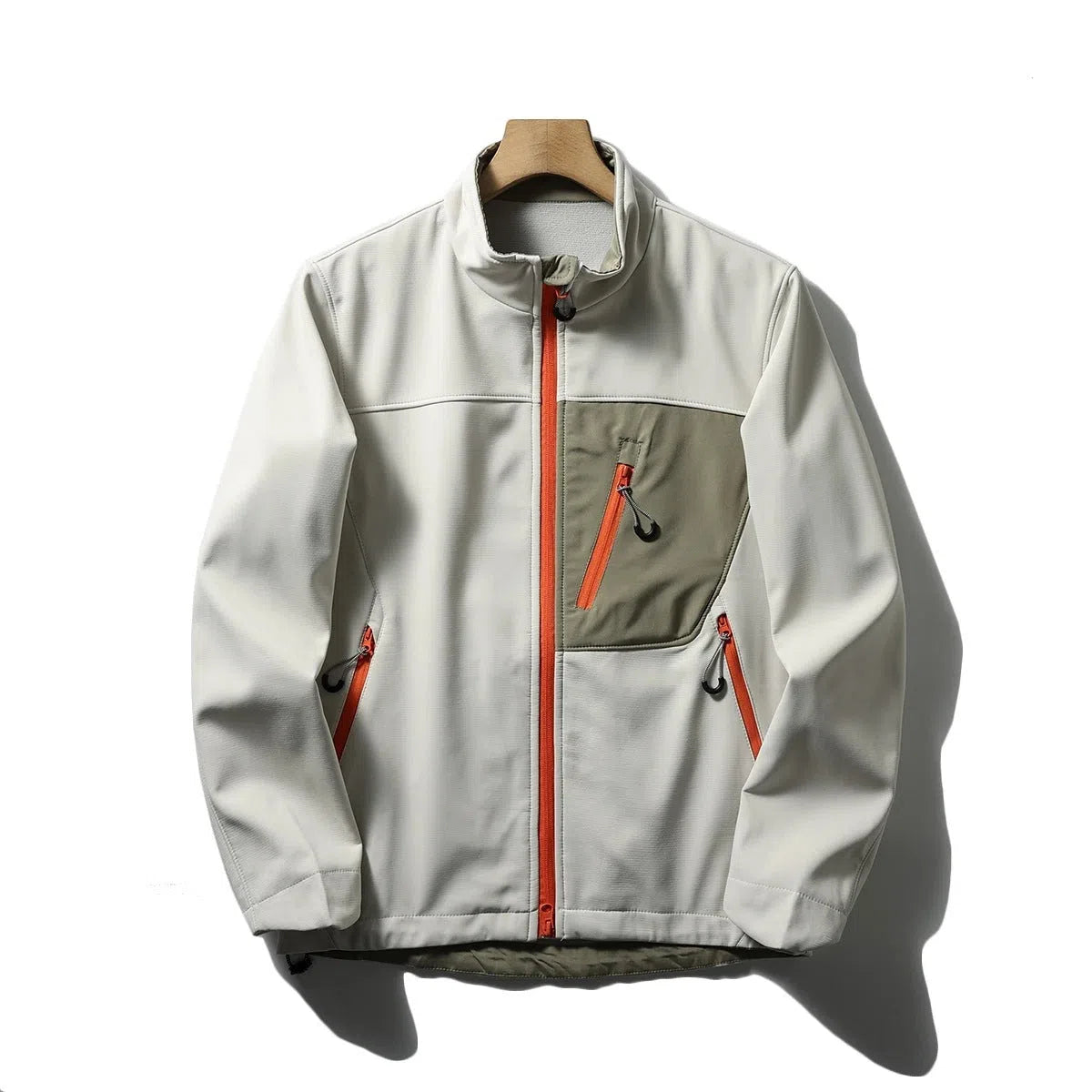 Men's retro patchwork contrast colour stand-up collar coat in Misty White, side view showing zipped pockets