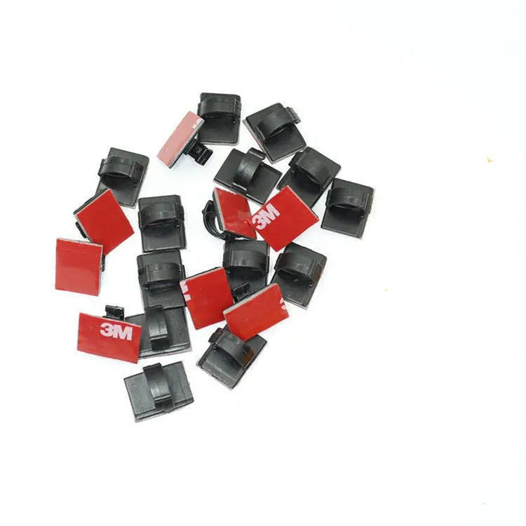 Black and white self-adhesive plastic wire buckles for securing cables, shown in assorted pack sizes.