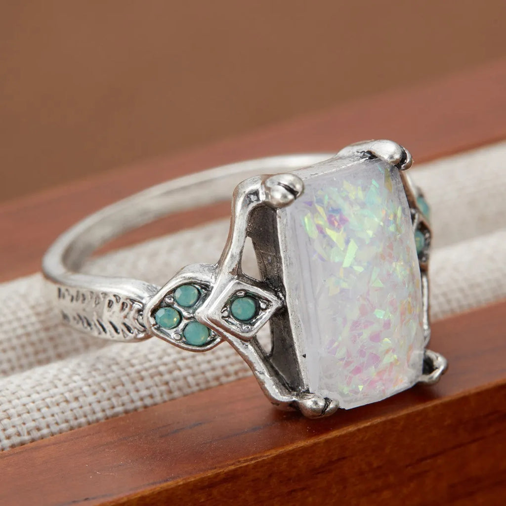 Rectangular white opal ancient silver ring on finger, silver tone, geometric design, alloy