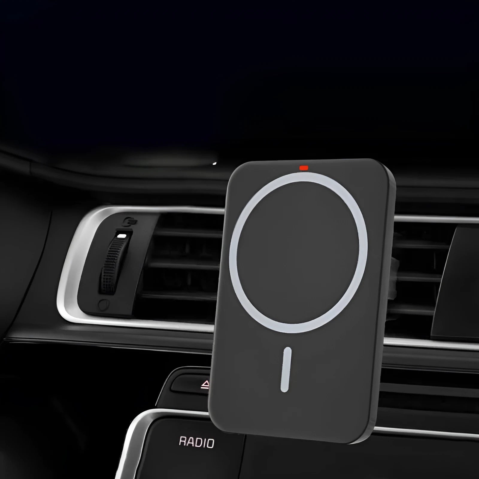 Black car magnetic wireless charger mounted on vehicle air vent with phone attached