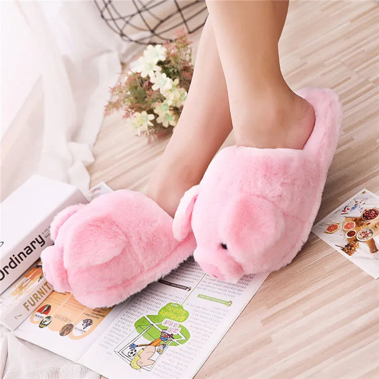 Pink pig plush floor slippers with soft short plush material and PP cotton filling.
