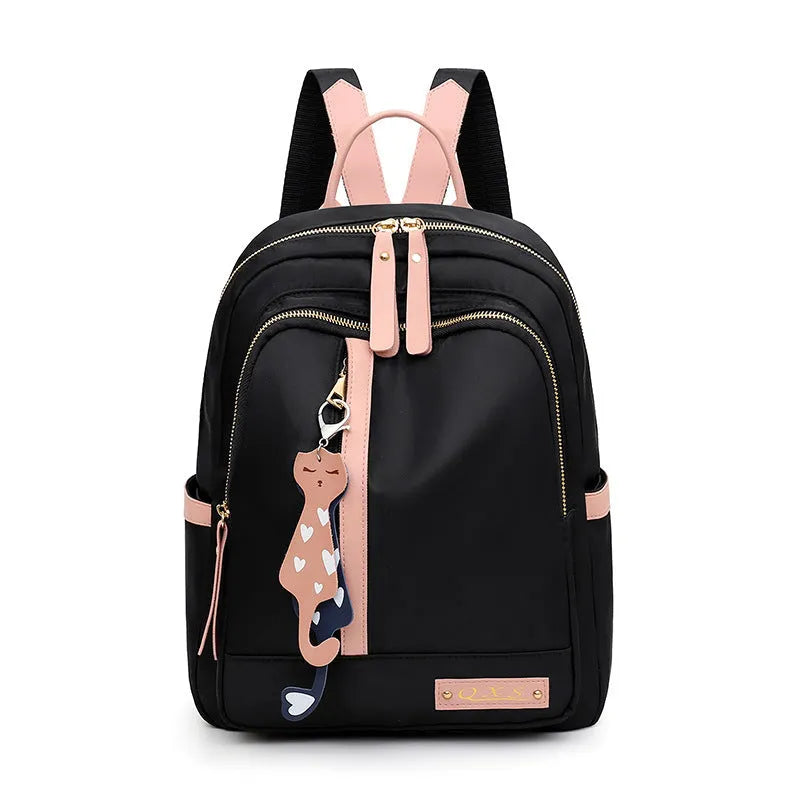 Black nylon casual backpack with square vertical shape, soft handle, and three-dimensional outer pocket