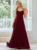 Women's sleeveless sling banquet dress with A-line long pleated skirt in solid colour polyester, front view