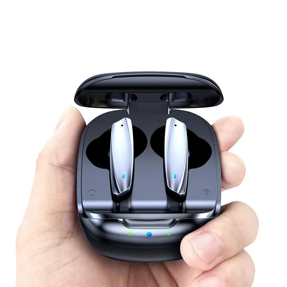 Black and white TWS Bluetooth 5.1 in-ear headphones with charging case and USB cable on a table.
